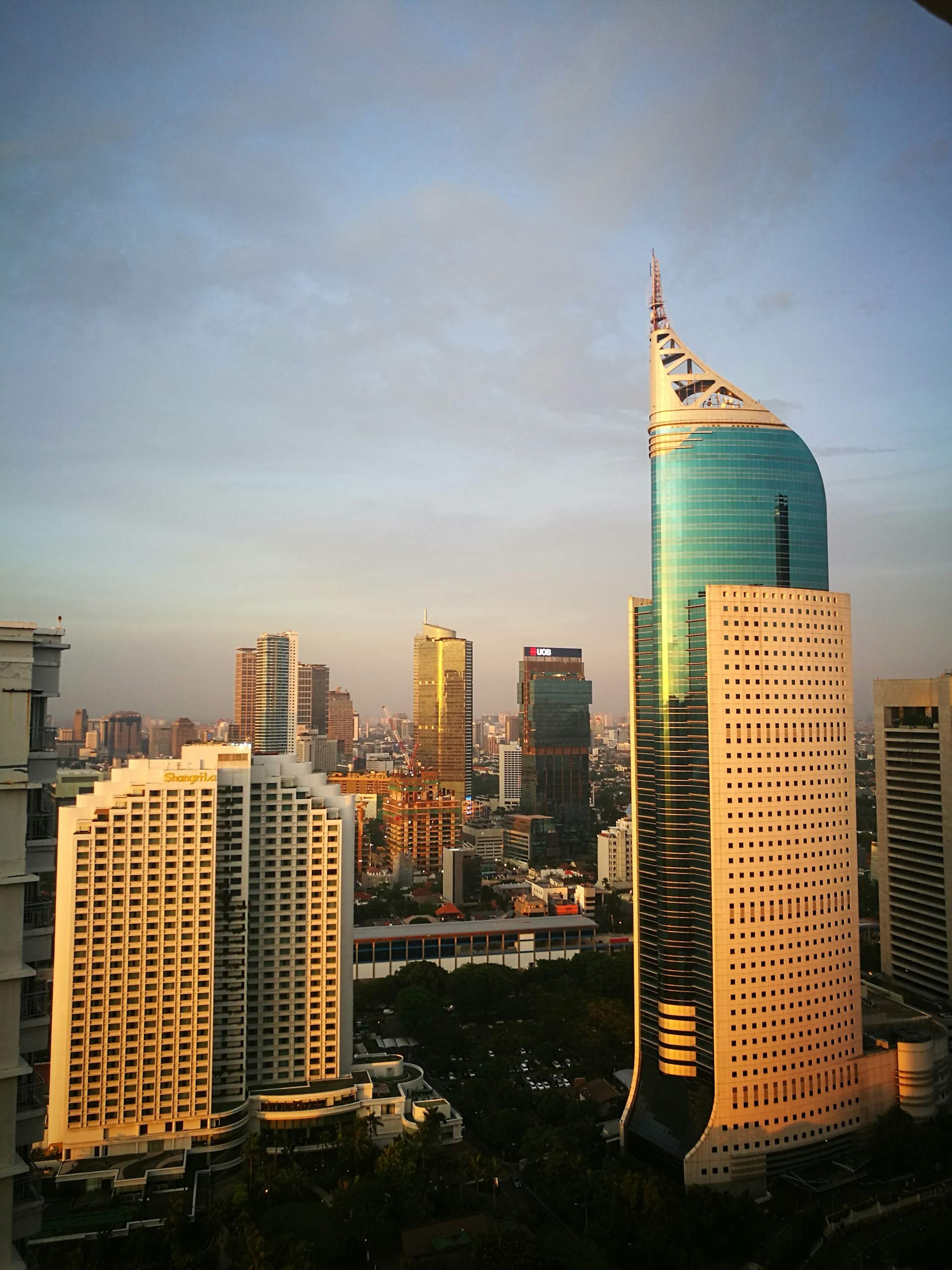 Executive boardroom overlooking a global city skyline at dusk